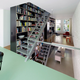 Illustration for article titled This Dream House Was Entirely Built Around a Giant Three-Story-High Bookshelf